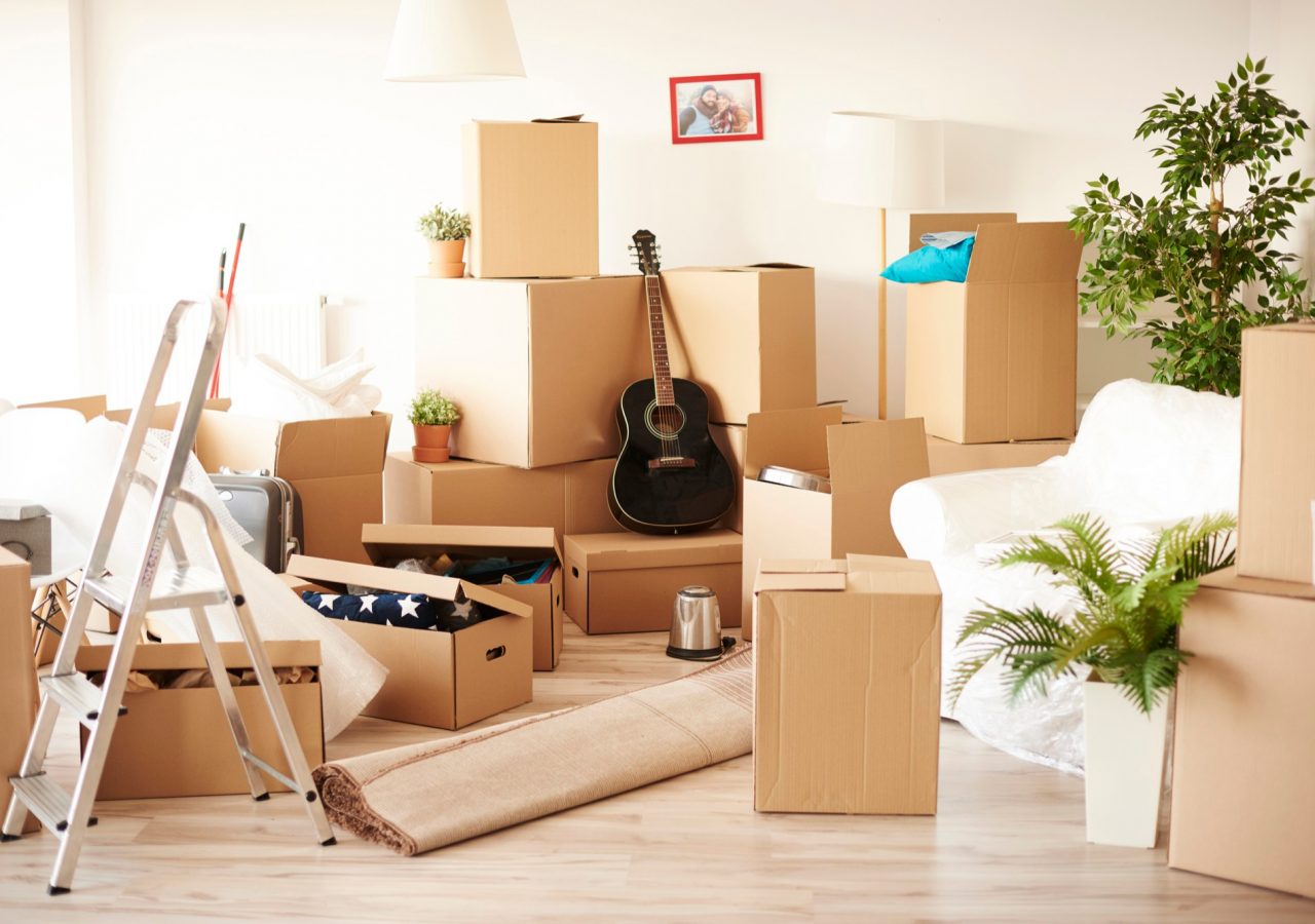 top-view-of-messy-and-full-of-moving-boxes-room